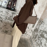 押し型ショルダーバッグ