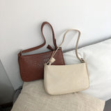 押し型ショルダーバッグ