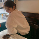 ハイネックギャザーブラウス